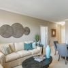 Wide angle shot of a spacious, open living room in an Erickson apartment. 