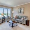 Wide shot of an open, sunny, living room in an Erickson apartment. 