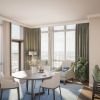 Wide angle shot of a spacious, open living room with corner balcony overlooking downtown Bethesda in an Erickson apartment. 