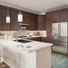 Modern and spacious apartment kitchen with sleek countertops, stainless steel appliances, and ample storage space.