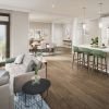 Spacious and inviting apartment living room with cozy seating, tasteful decor, and abundant natural light.