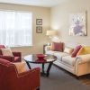Comfortable and well-furnished living room in an Erickson Senior Living community apartment.