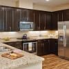 Modern kitchen in an Erickson Senior Living community apartment with stainless steel appliances.