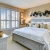 Cozy bedroom in an Erickson Senior Living community apartment with modern furnishings.
