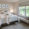 Cozy bedroom in an Erickson Senior Living community apartment with modern furnishings.