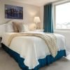 Cozy bedroom in an Erickson Senior Living community apartment with modern furnishings.