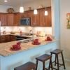 Modern and spacious apartment kitchen with sleek countertops, stainless steel appliances, and ample storage space