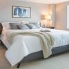Cozy bedroom in an Erickson Senior Living community apartment with modern furnishings.