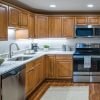 Modern kitchen in an Erickson Senior Living community apartment with stainless steel appliances.
