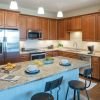 Modern kitchen in an Erickson Senior Living community apartment with stainless steel appliances.