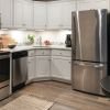 Modern and spacious apartment kitchen with sleek countertops, stainless steel appliances, and ample storage space.