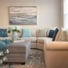 Close-up shot of a modern sofa and wall painting in a spacious Erickson apartment living room.