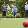 4 residents having a spirited game of bocce ball